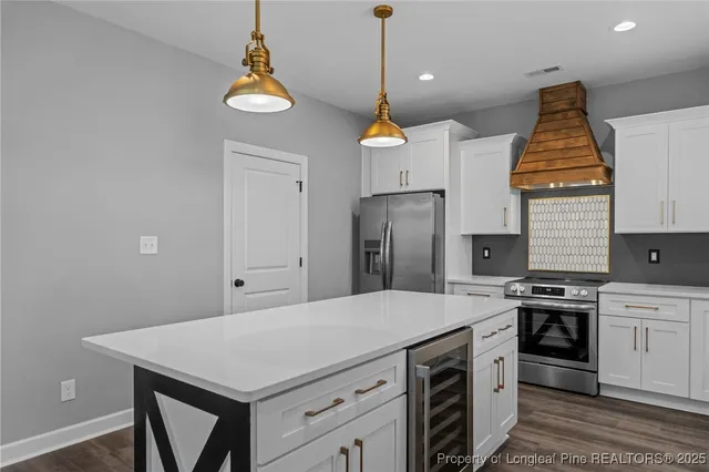 a kitchen with a stove a refrigerator a sink and dishwasher