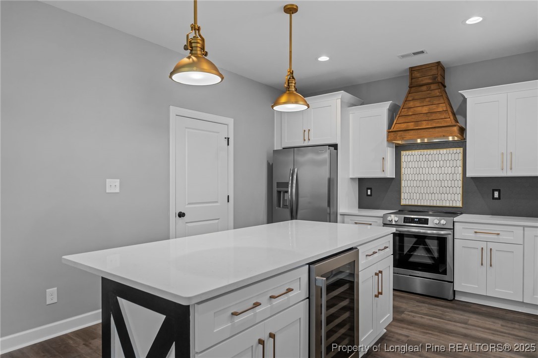 314 Persimmon Tree Drive Cameron, NC 28326 - Photo 14 of 46 a kitchen with a stove a refrigerator a sink and dishwasher