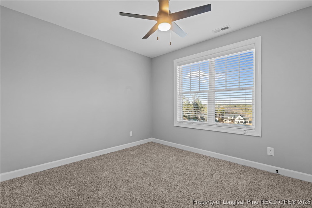 314 Persimmon Tree Drive Cameron, NC 28326 - Photo 25 of 46 a view of an empty room with a window
