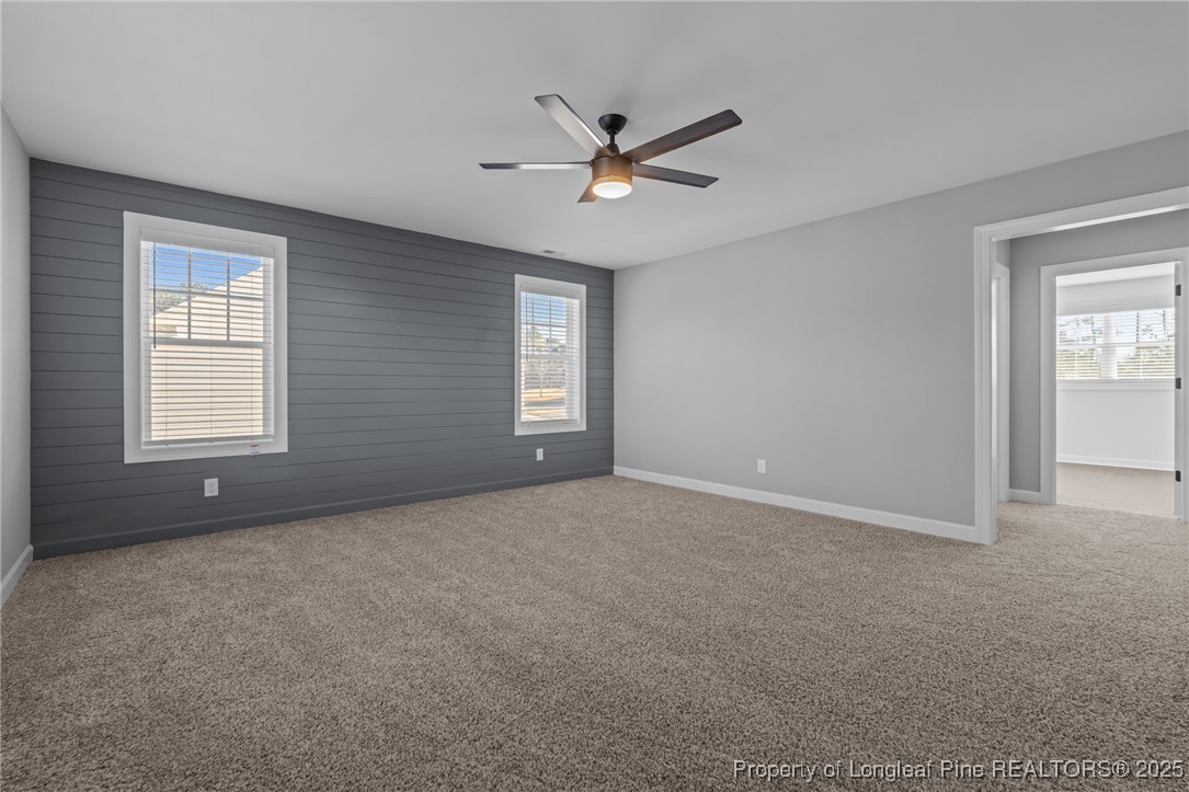 314 Persimmon Tree Drive Cameron, NC 28326 - Photo 28 of 46 a view of a livingroom with a ceiling fan and window