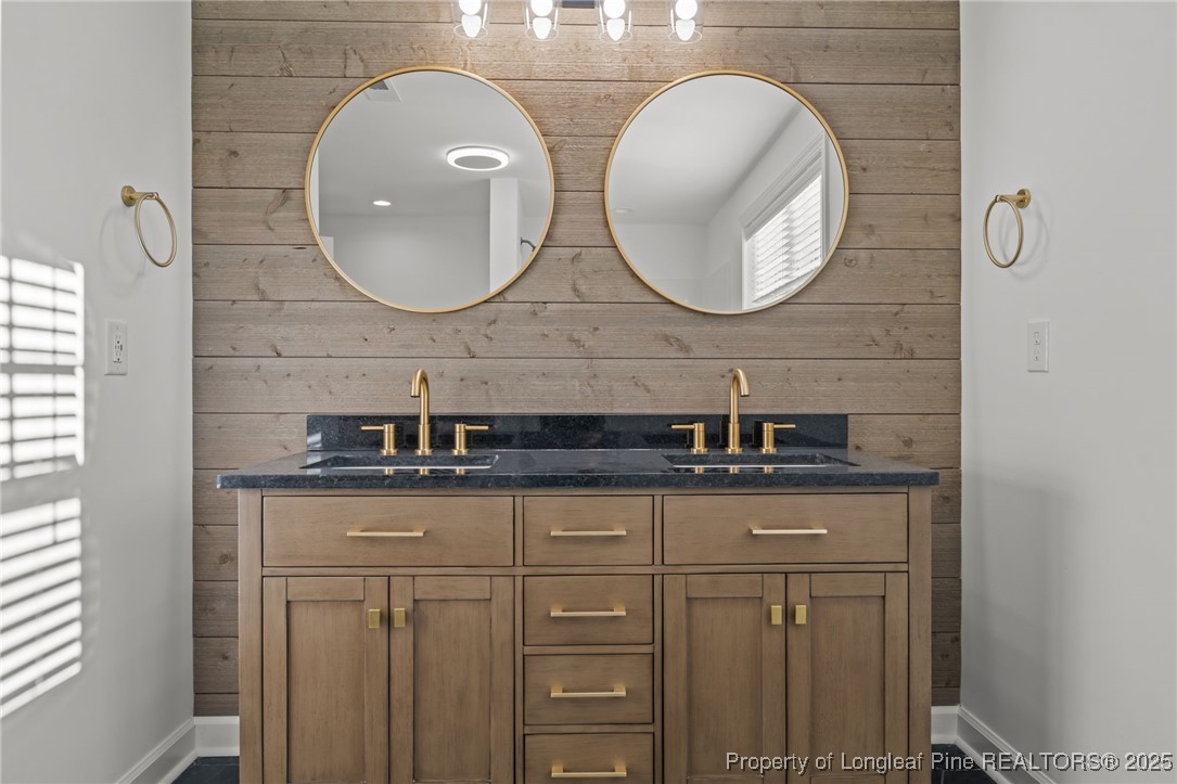314 Persimmon Tree Drive Cameron, NC 28326 - Photo 31 of 46 a bathroom with double sink and a mirror