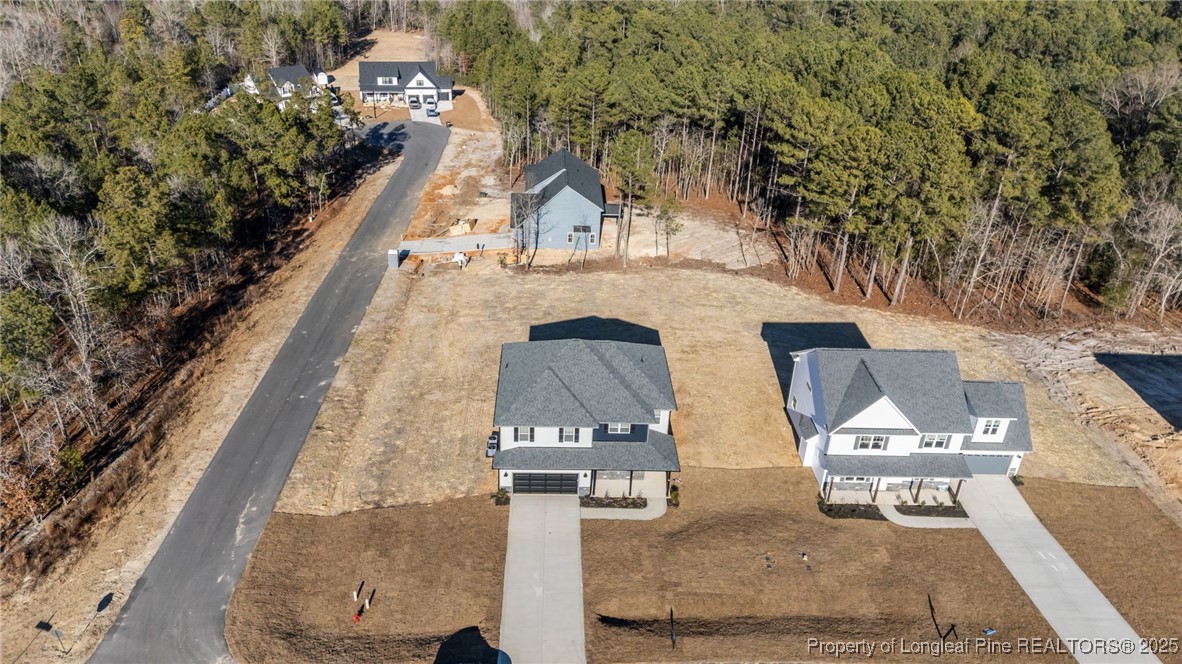 314 Persimmon Tree Drive Cameron, NC 28326 - Photo 39 of 46 an aerial view of a house with a yard and large trees