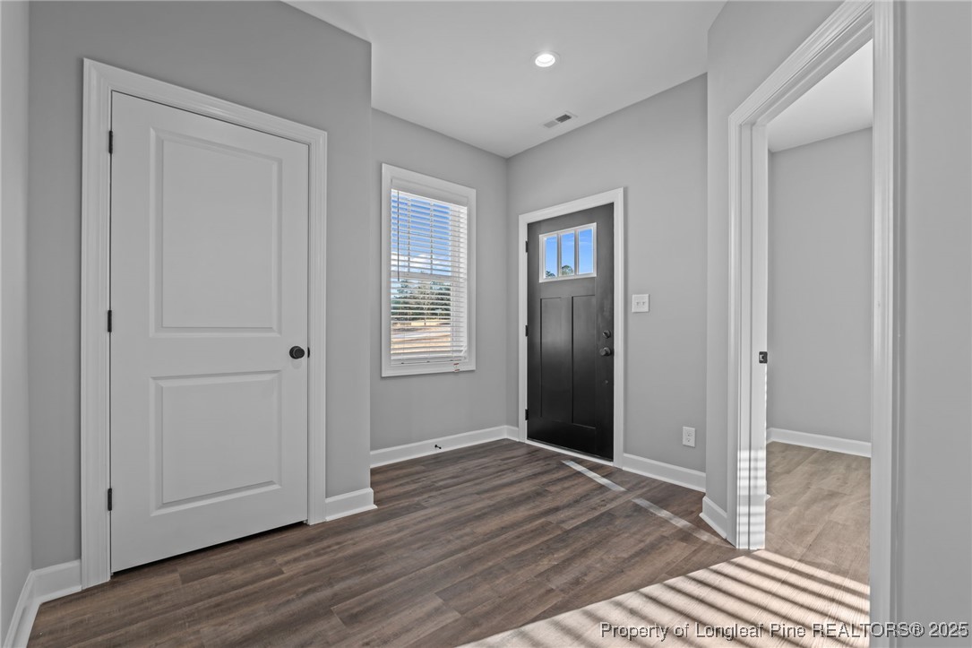 314 Persimmon Tree Drive Cameron, NC 28326 - Photo 4 of 46 a view of livingroom with hardwood floor and hallway