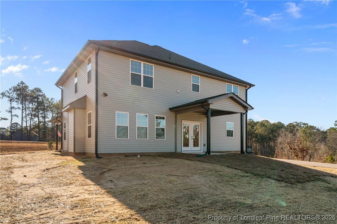 314 Persimmon Tree Drive Cameron, NC 28326 - Photo 42 of 46 a front view of a house with a yard