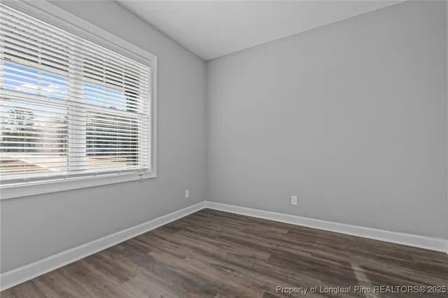 wooden floor and window in an empty room