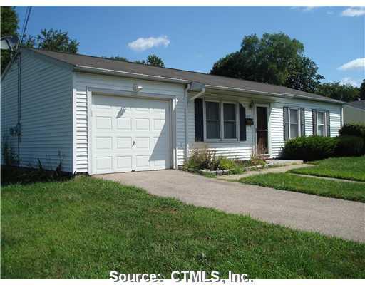 171 Indian Field Road Groton, CT 06340 - Photo 1 of 1 a front view of a house with a yard and garage