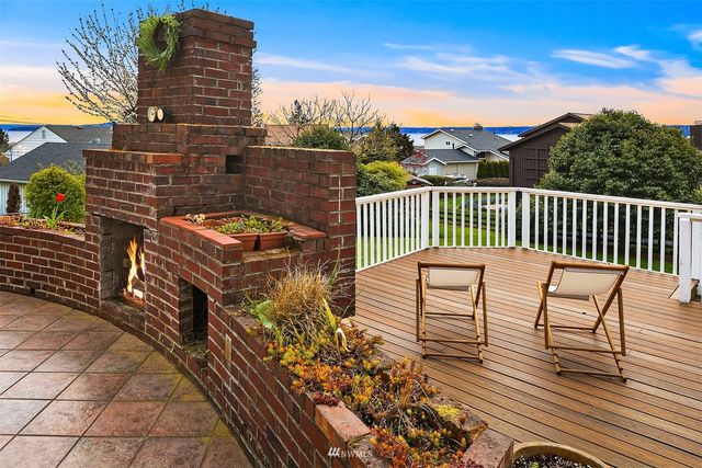 a view of a balcony with wooden floor