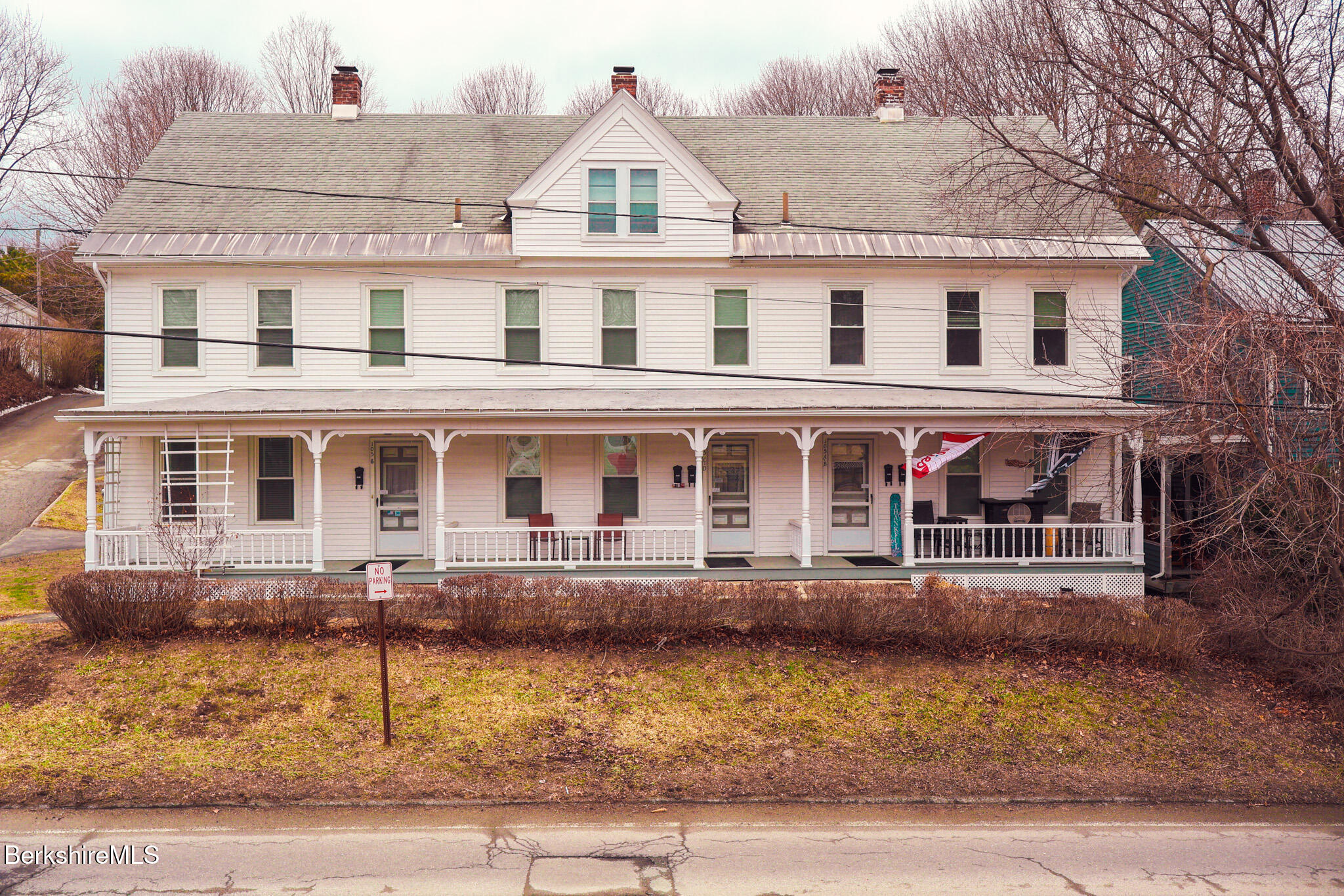 105 Friend Street Adams, MA 01220 - Photo 1 of 27 a front view of a house with lots of windows