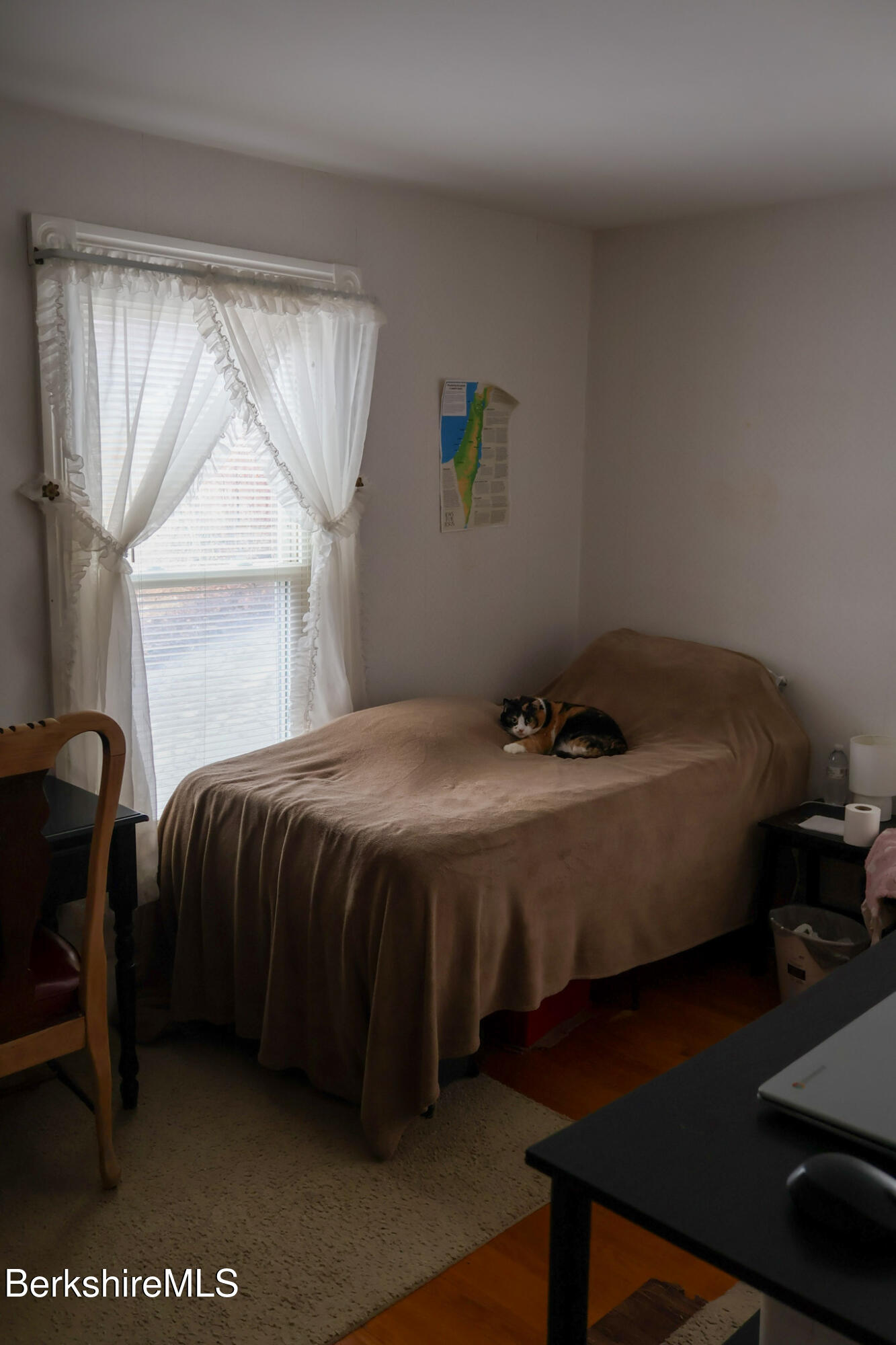 105 Friend Street Adams, MA 01220 - Photo 21 of 27 a bed sitting in a bedroom next to a window