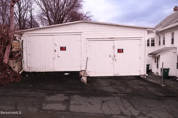 a front view of a house with a street