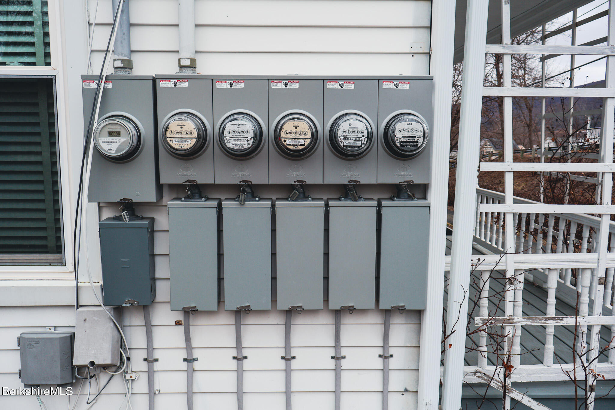 105 Friend Street Adams, MA 01220 - Photo 5 of 27 a black and white wall with a clock on it