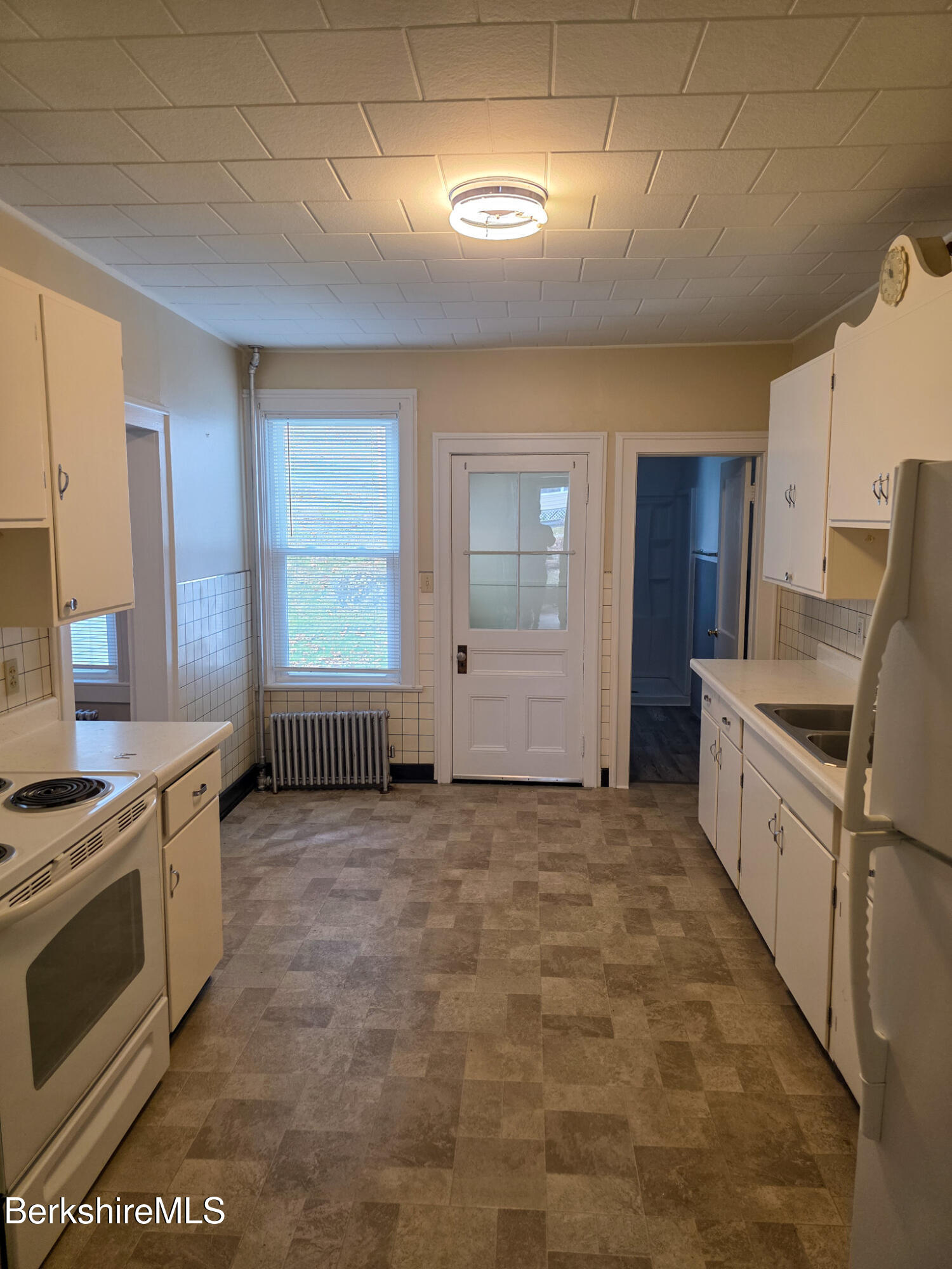 105 Friend Street Adams, MA 01220 - Photo 6 of 27 a view of a kitchen with electric appliances