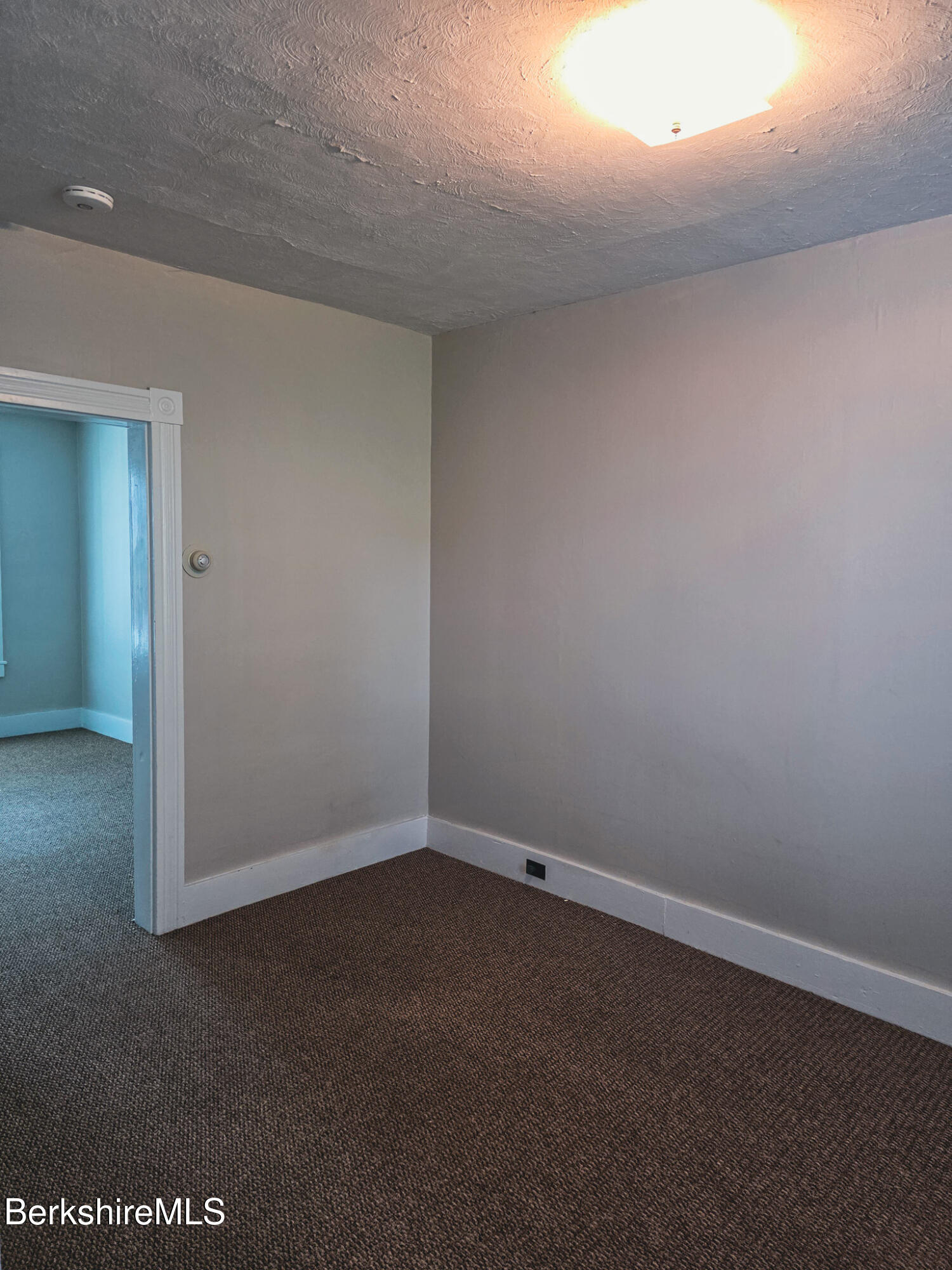 105 Friend Street Adams, MA 01220 - Photo 7 of 27 an empty room with a empty space and windows