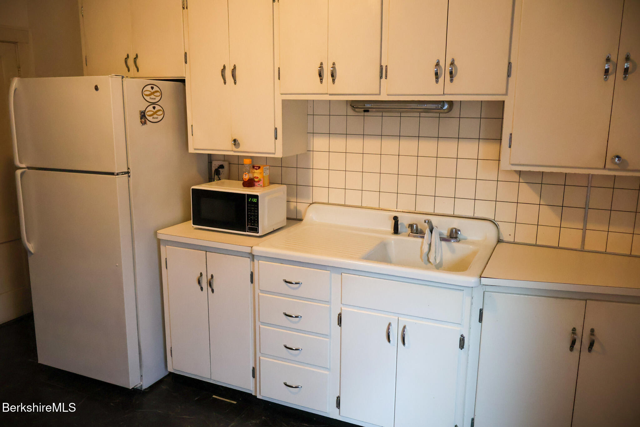 105 Friend Street Adams, MA 01220 - Photo 10 of 27 a kitchen with a refrigerator sink and cabinets