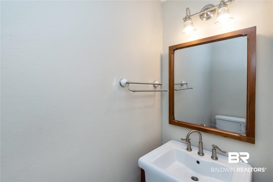 6109 Timberly Road North Mobile, AL 36609 - Photo 14 of 26 Bathroom featuring toilet and sink
