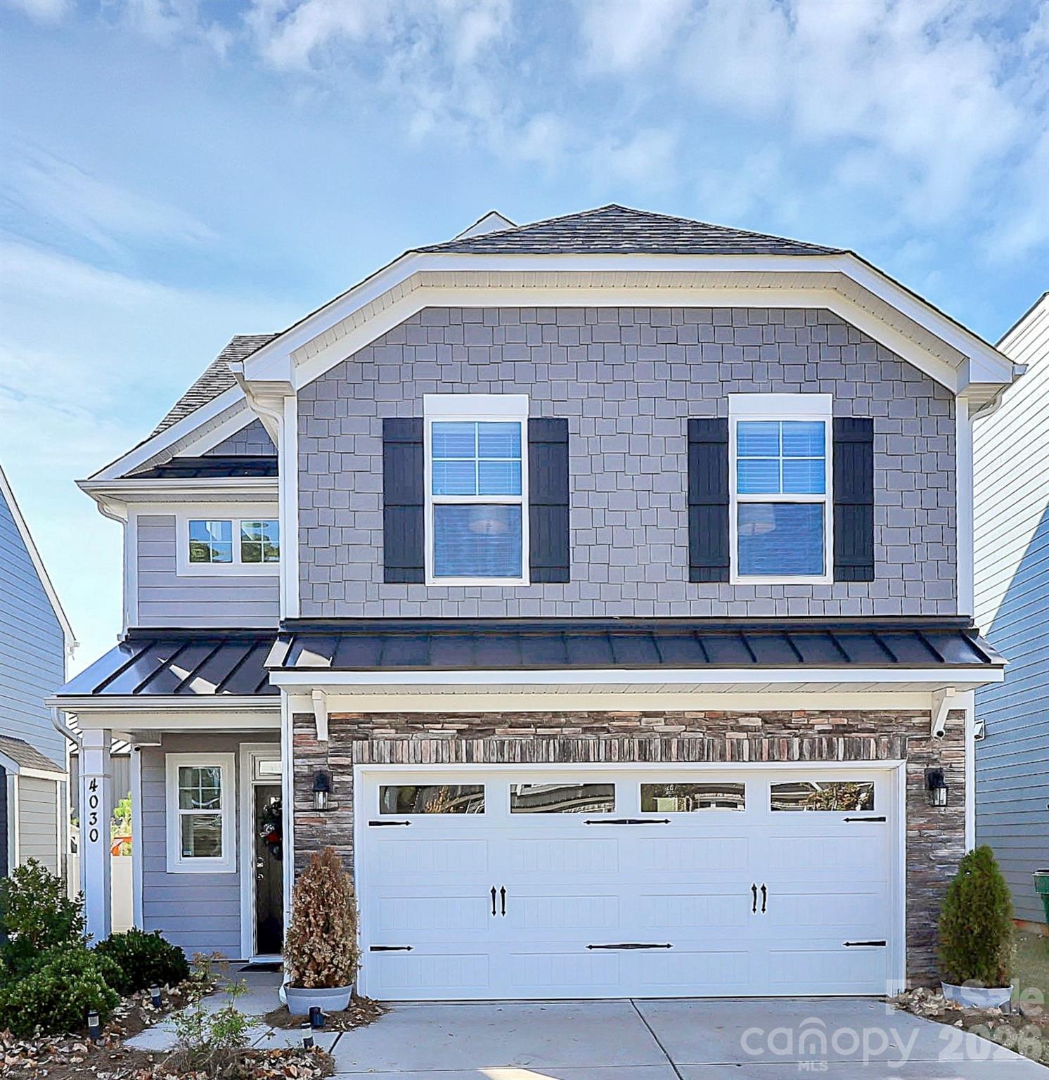 a view of a house with a street