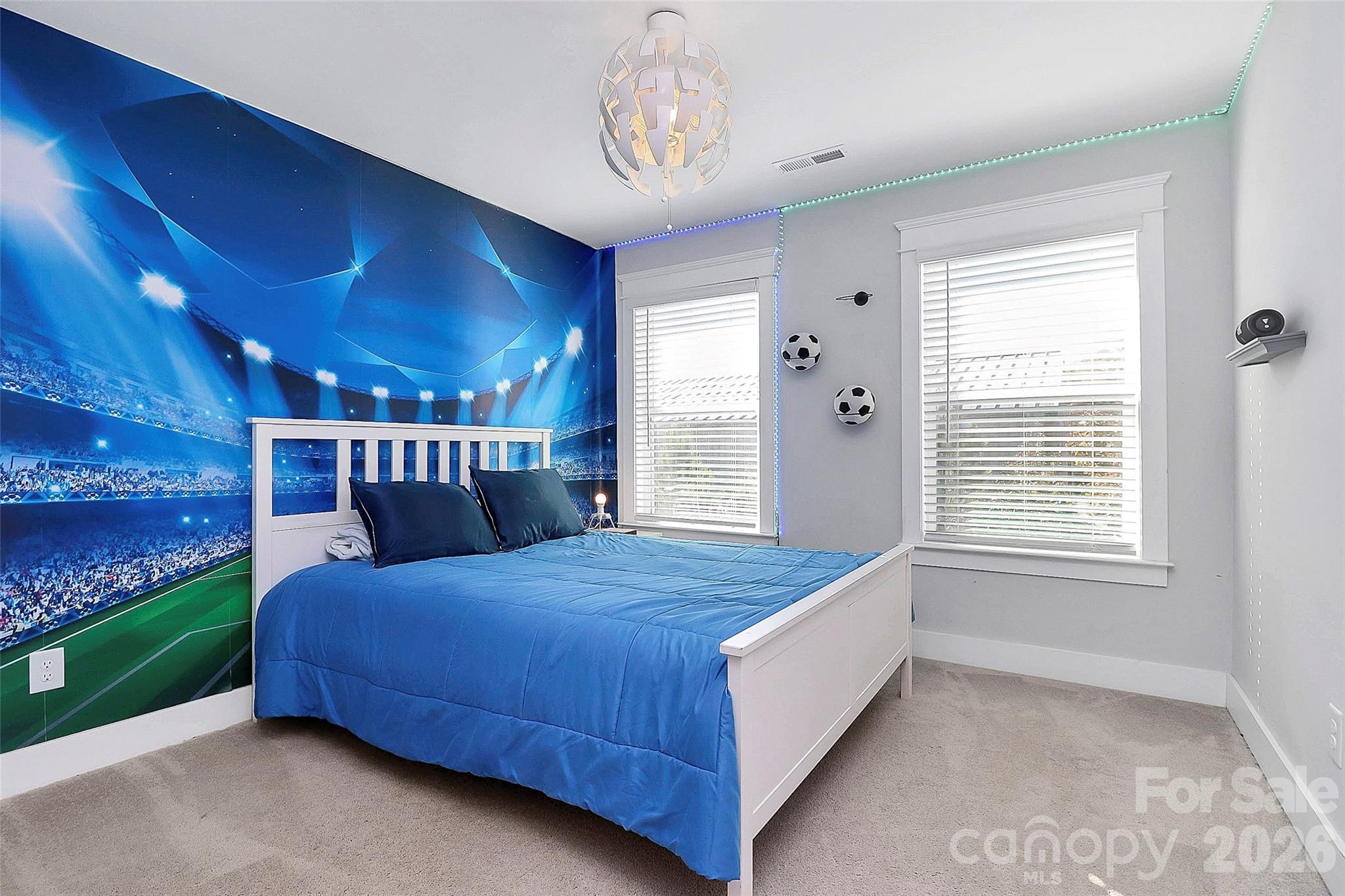 4030 Belle Landing Road, Unit 7 Charlotte, NC 28270 - Photo 17 of 24 a bed sitting in a room next to a window