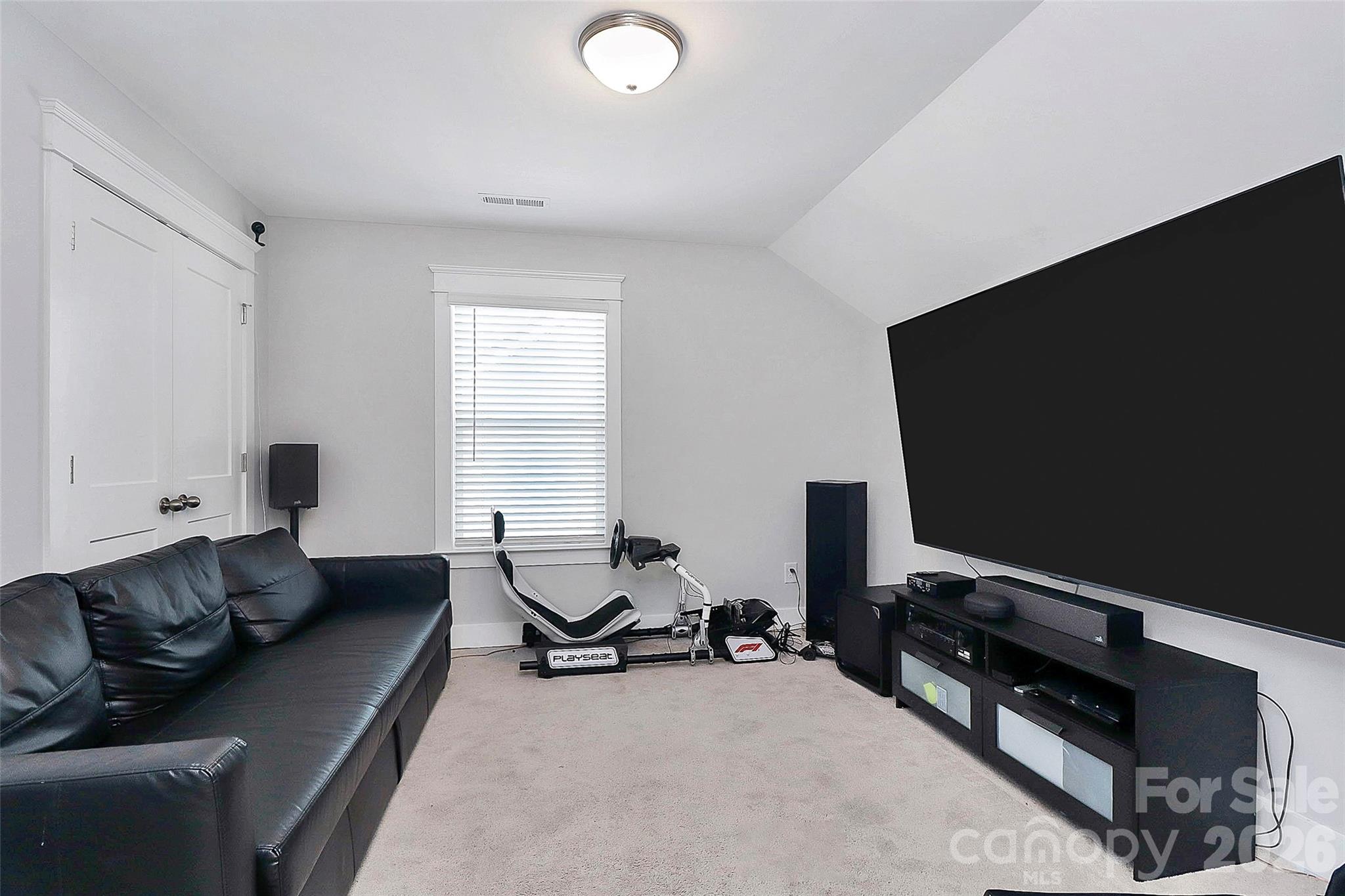 4030 Belle Landing Road, Unit 7 Charlotte, NC 28270 - Photo 18 of 24 a living room with furniture and a flat screen tv