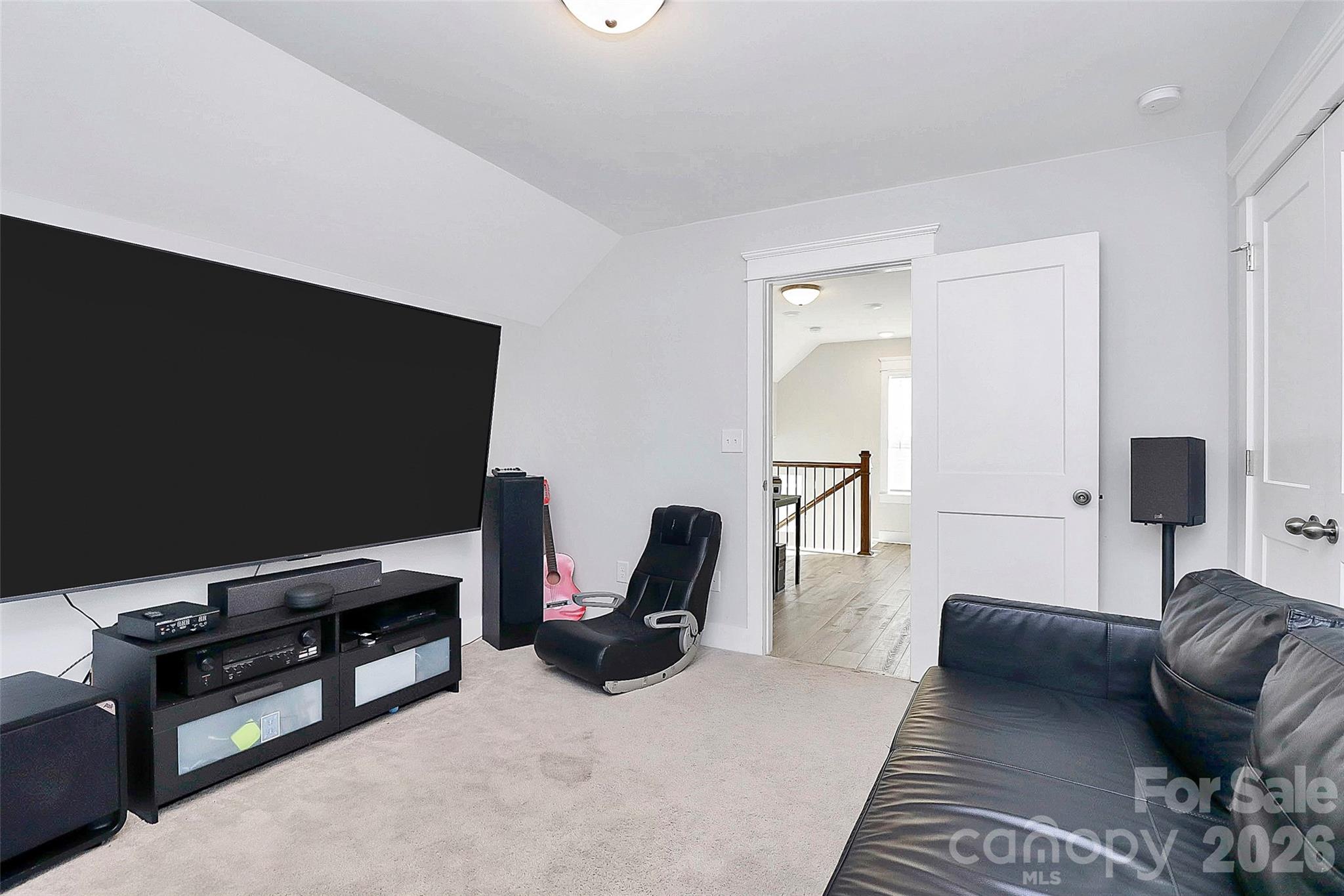 4030 Belle Landing Road, Unit 7 Charlotte, NC 28270 - Photo 19 of 24 a bedroom with furniture and a flat screen tv