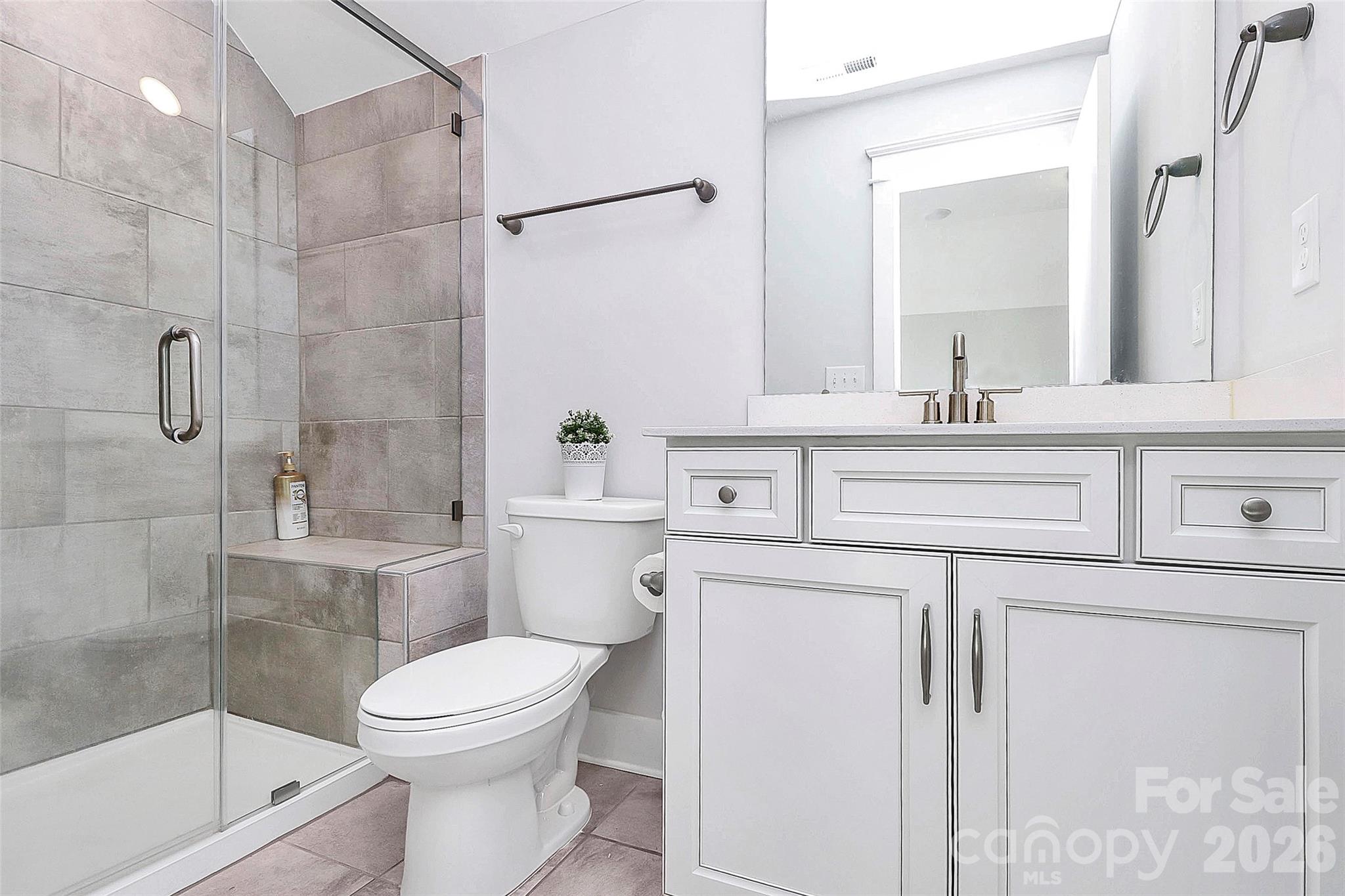 4030 Belle Landing Road, Unit 7 Charlotte, NC 28270 - Photo 21 of 24 a bathroom with a sink a toilet and shower