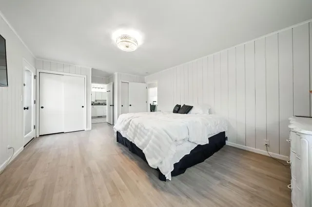 a backyard of a house with a yard and outdoor seating