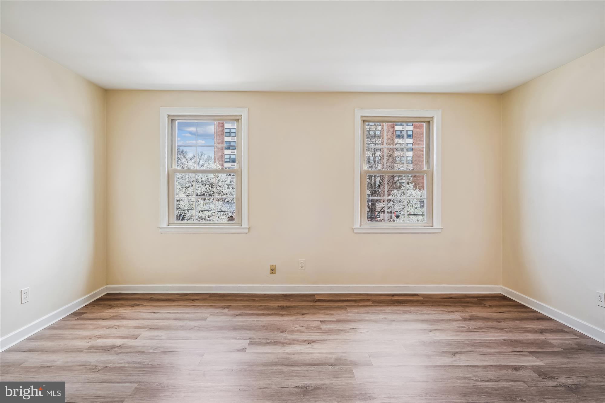 2202 Colston Drive, Unit 2202C Silver Spring, MD 20910 - Photo 14 of 42 a view of a room with wooden floor and window