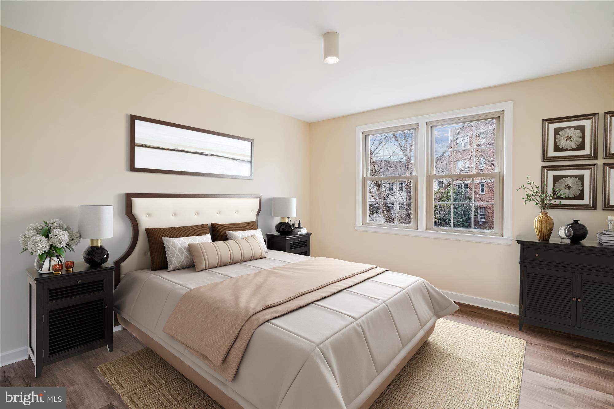 2202 Colston Drive, Unit 2202C Silver Spring, MD 20910 - Photo 2 of 42 a bedroom with a bed and wooden floor