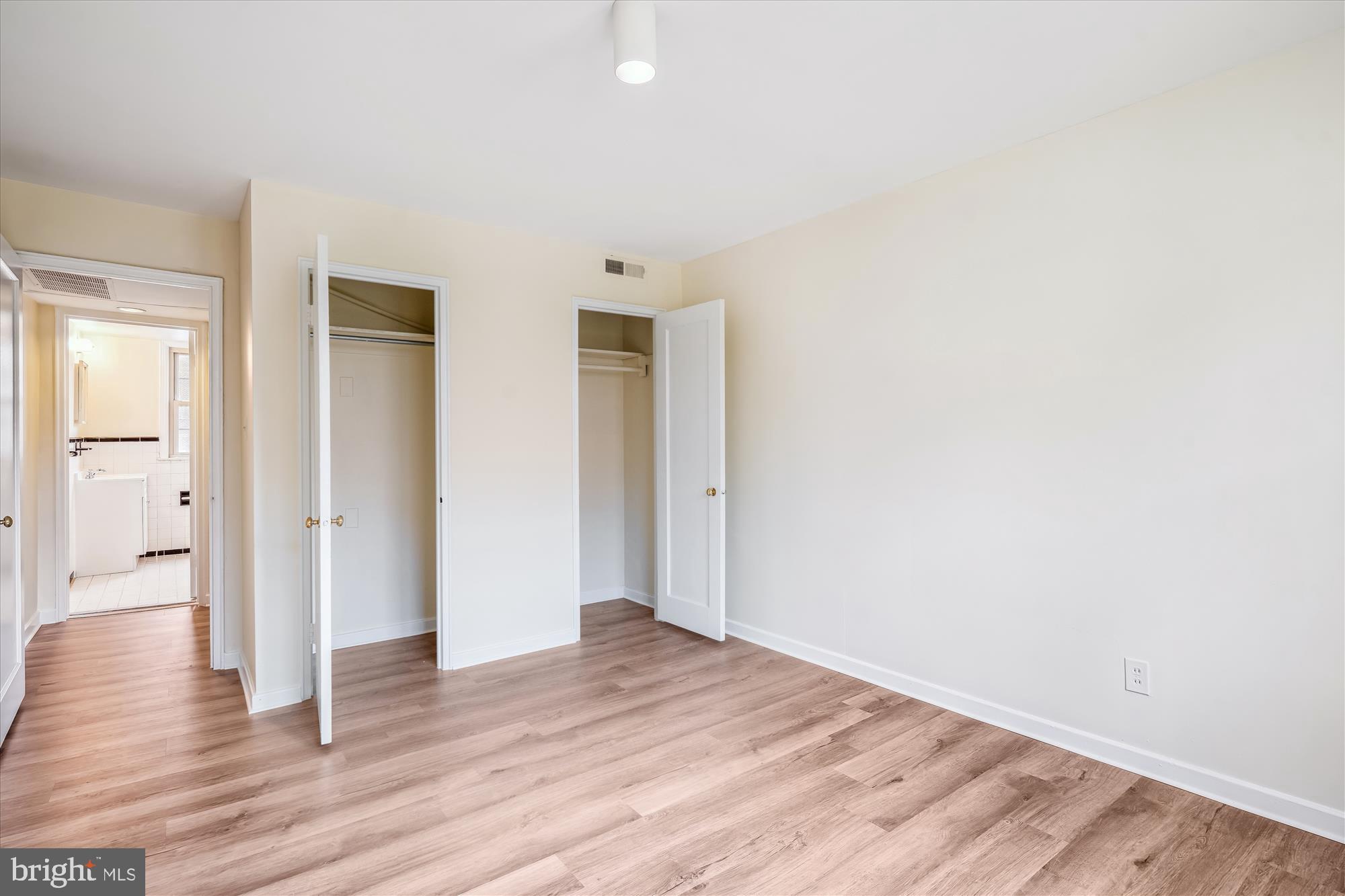 2202 Colston Drive, Unit 2202C Silver Spring, MD 20910 - Photo 21 of 42 a view of an empty room with wooden floor