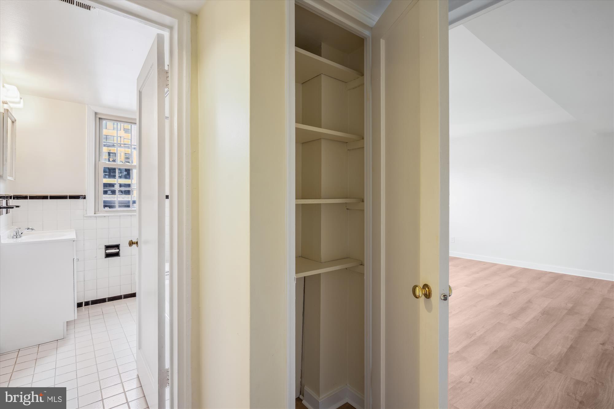 2202 Colston Drive, Unit 2202C Silver Spring, MD 20910 - Photo 22 of 42 a view of bathroom with a sink mirror and shower