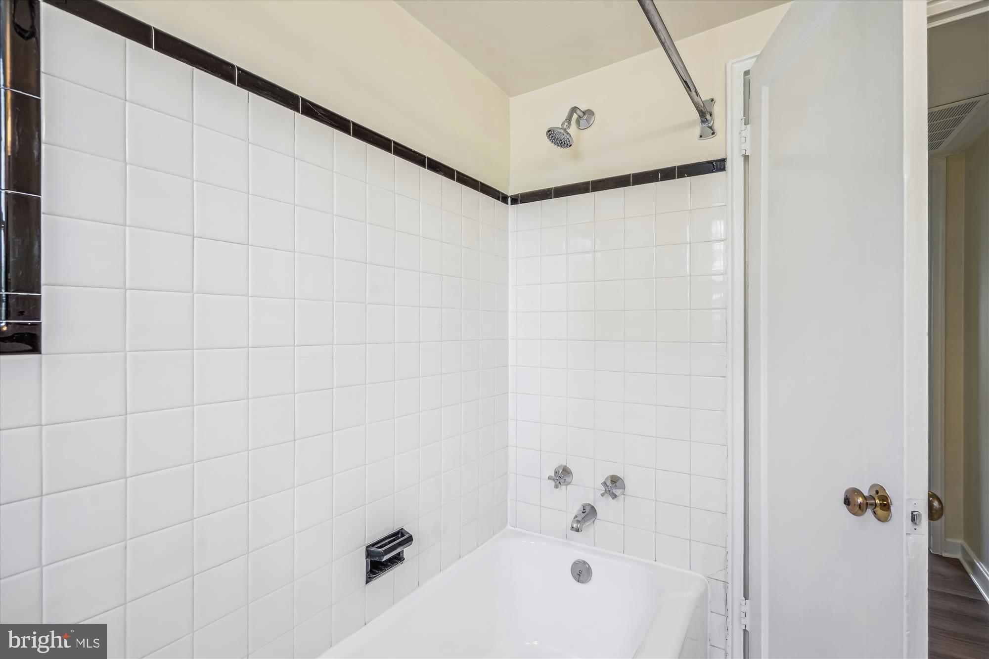 2202 Colston Drive, Unit 2202C Silver Spring, MD 20910 - Photo 23 of 42 a bathroom with a bathtub and shower