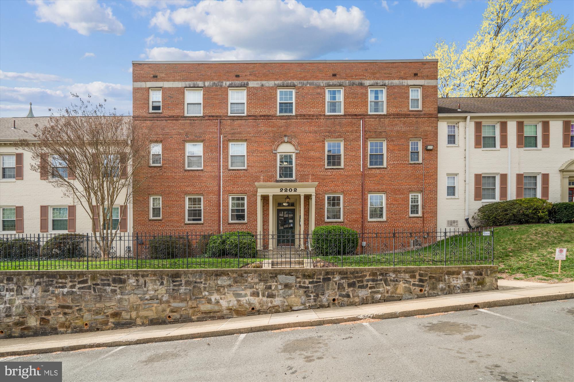 2202 Colston Drive, Unit 2202C Silver Spring, MD 20910 - Photo 4 of 42 a front view of a house with a yard