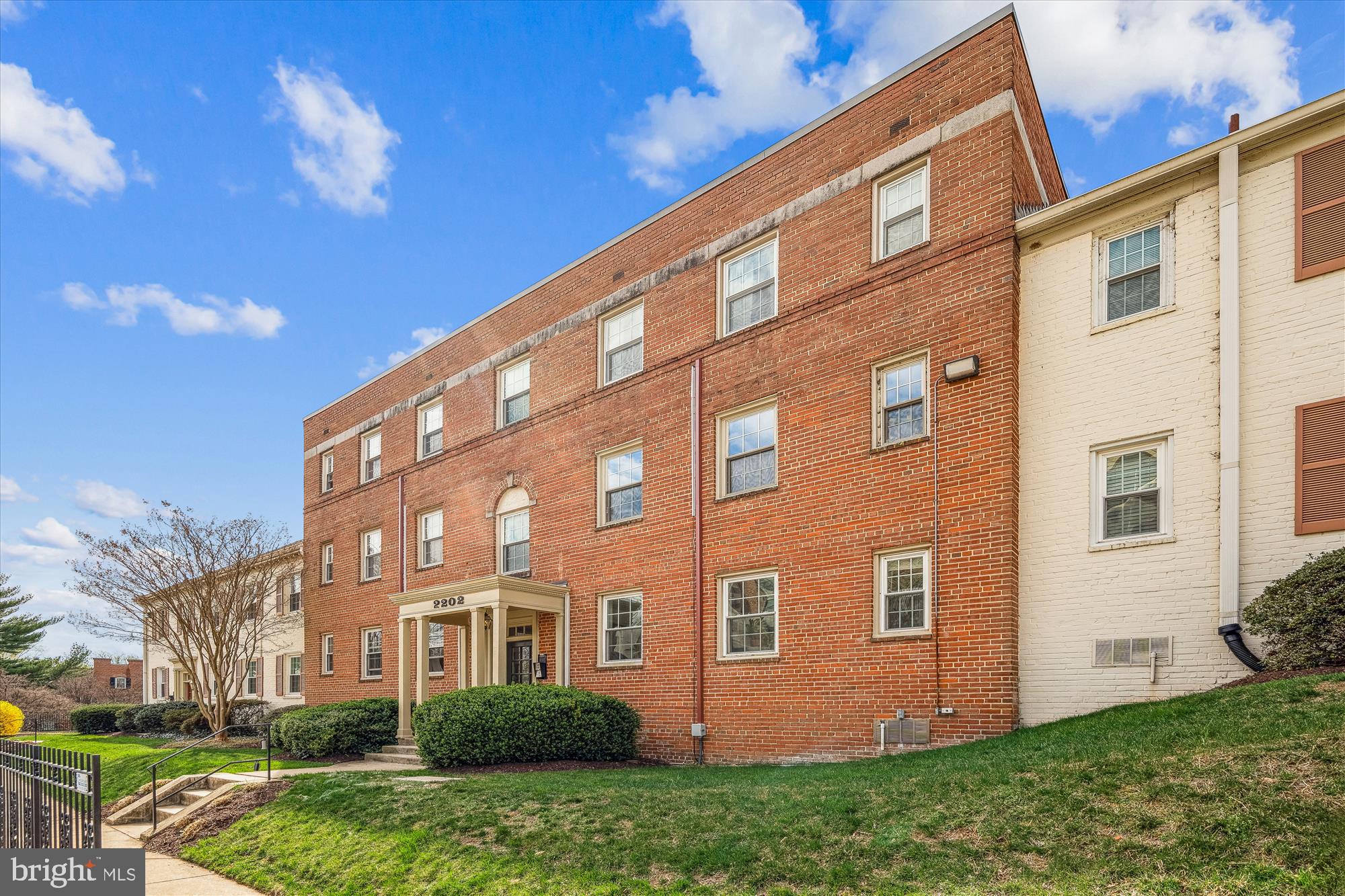 2202 Colston Drive, Unit 2202C Silver Spring, MD 20910 - Photo 5 of 42 a view of a building with a yard