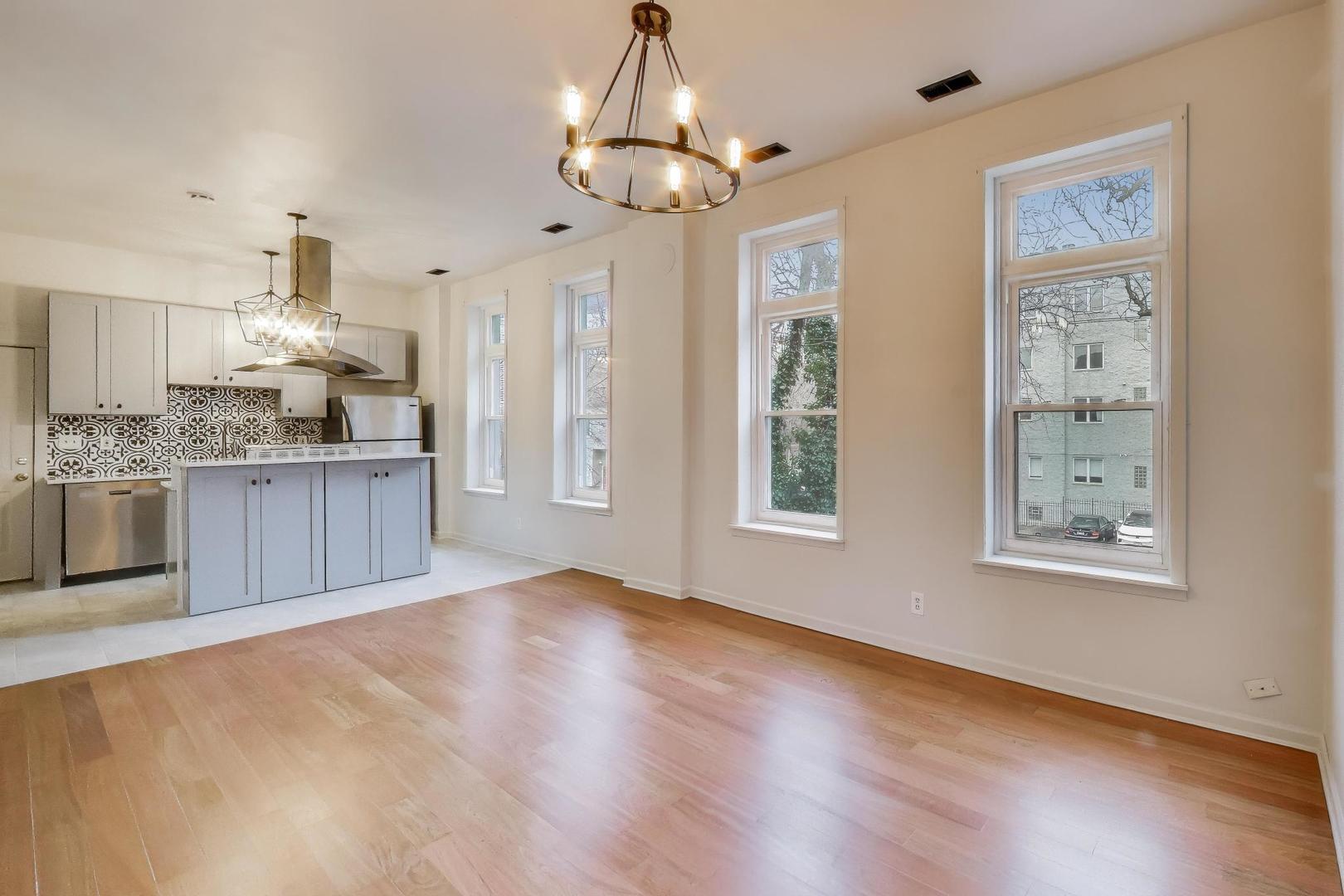 600 North May Street, Unit 2R Chicago, IL 60642 - Photo 2 of 19 a view of a kitchen with an entryway and wooden floor