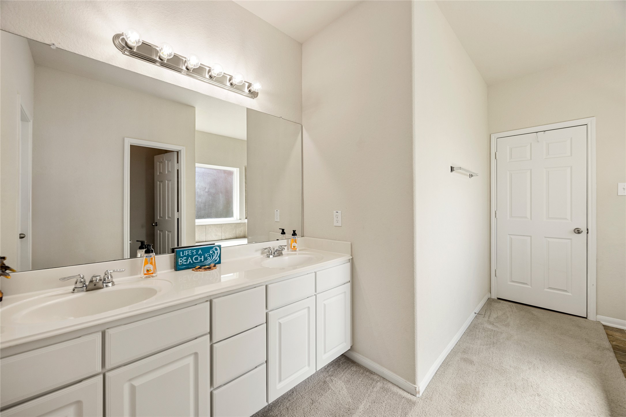 4202 Brightridge Drive Rosenberg, TX 77471 - Photo 11 of 23 a bathroom with double sink and a mirror