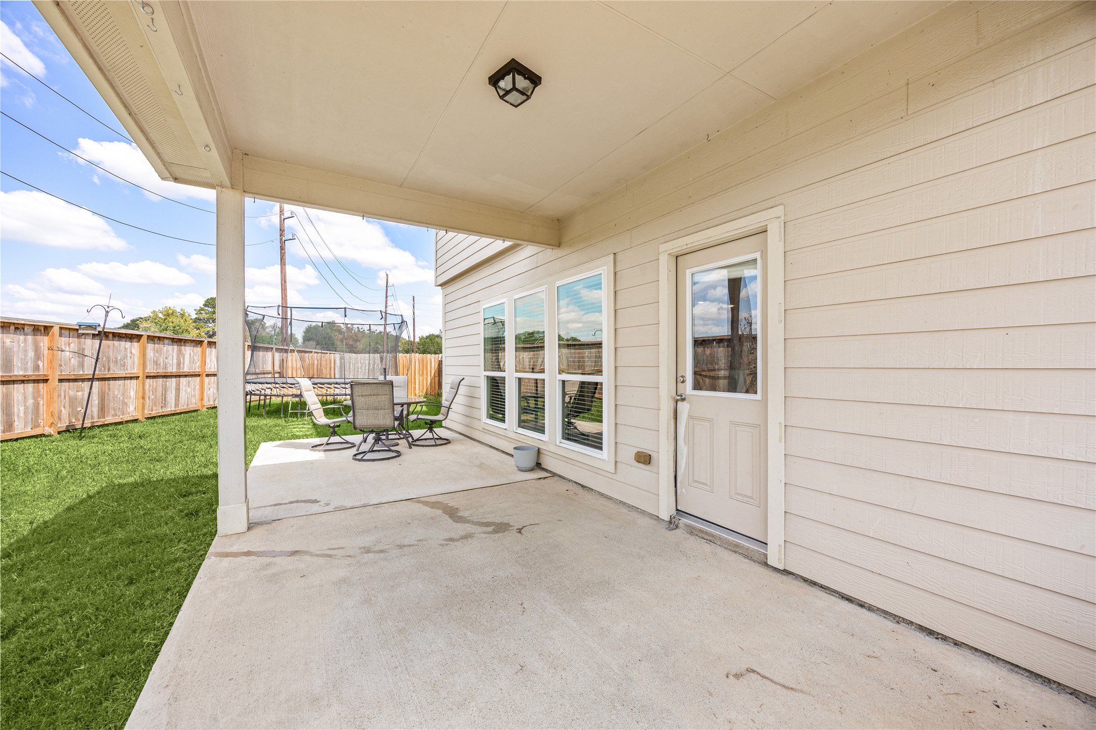 4202 Brightridge Drive Rosenberg, TX 77471 - Photo 20 of 23 a view of a porch with wooden floor and fence