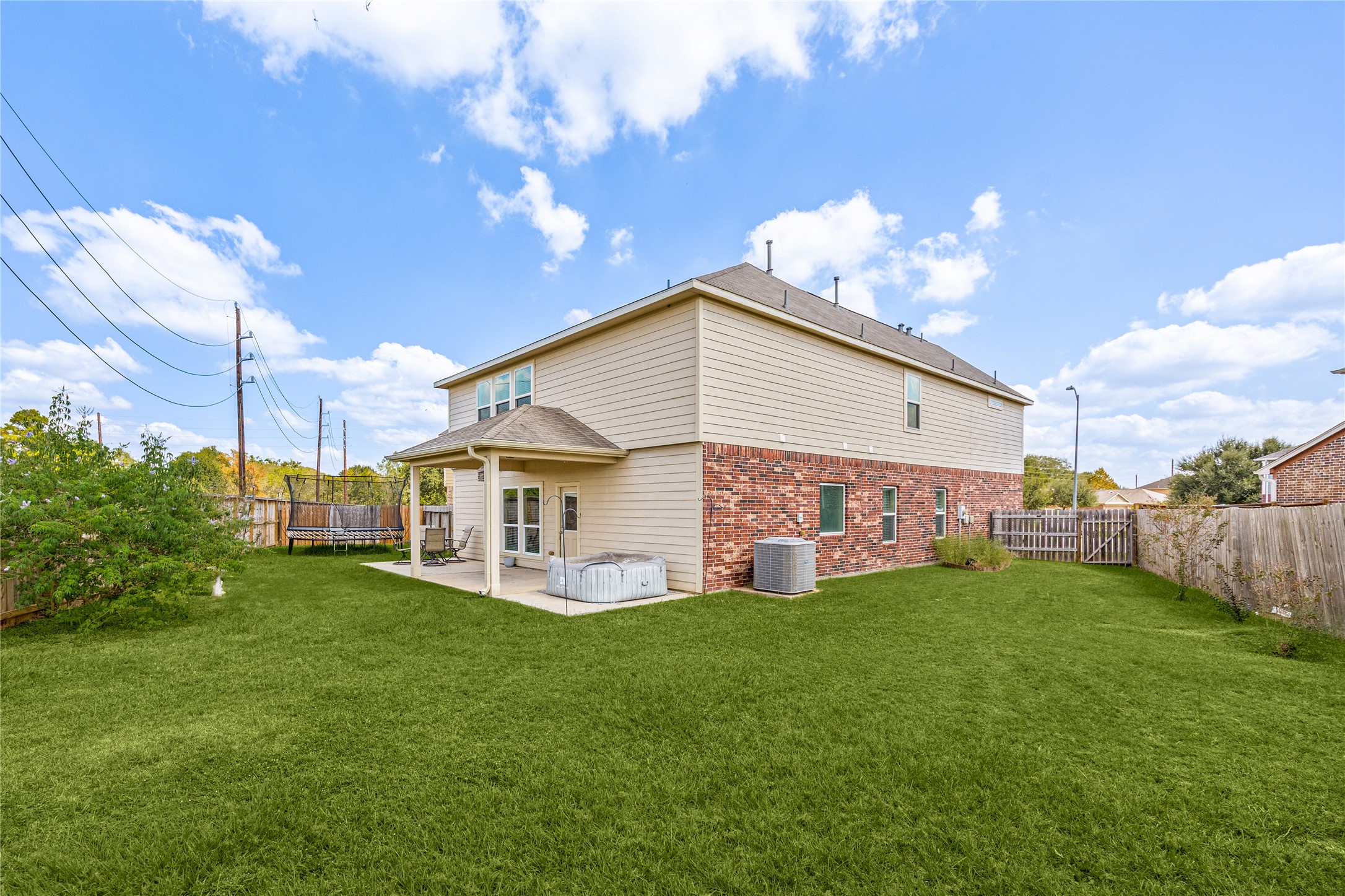 4202 Brightridge Drive Rosenberg, TX 77471 - Photo 22 of 23 a view of a house with a yard and a patio