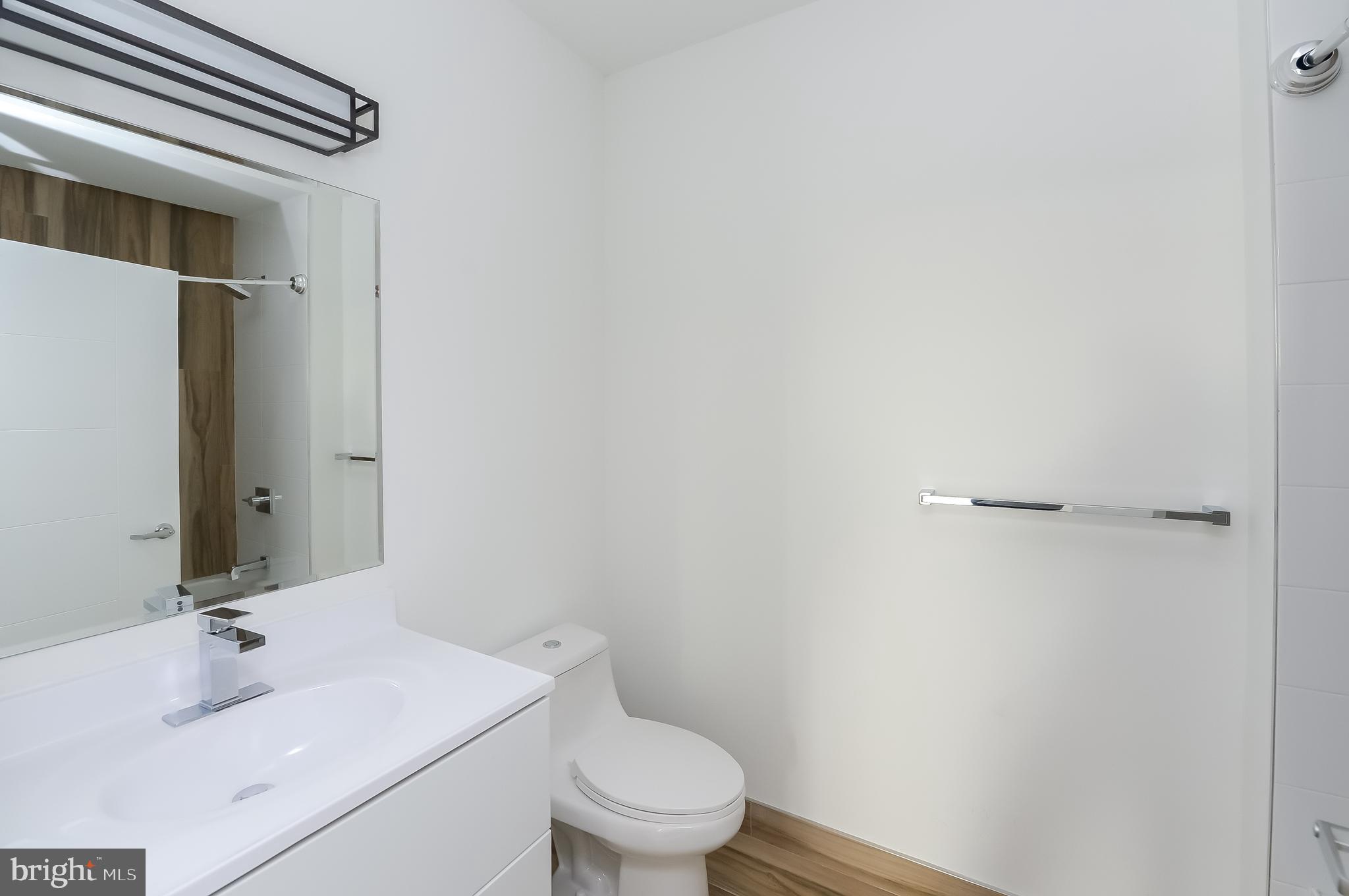 236 West Thompson Street, Unit B501 Philadelphia, PA 19122 - Photo 30 of 48 a bathroom with a sink and a mirror