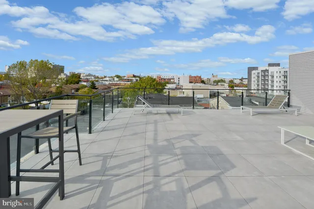 a view of a terrace with furniture