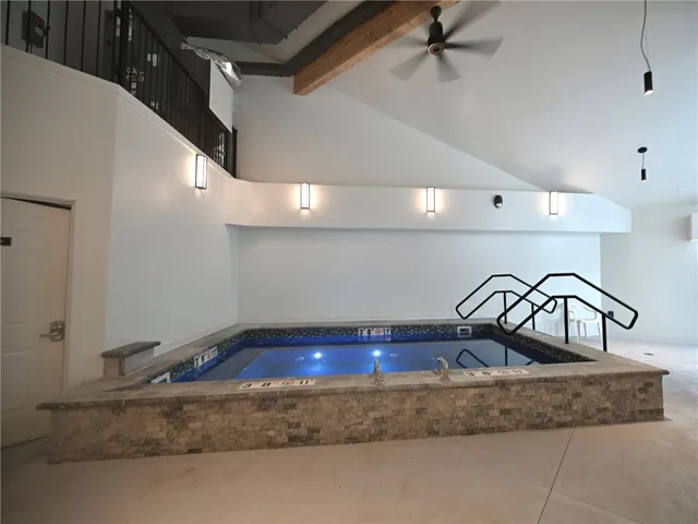 a bathroom with a granite countertop sink
