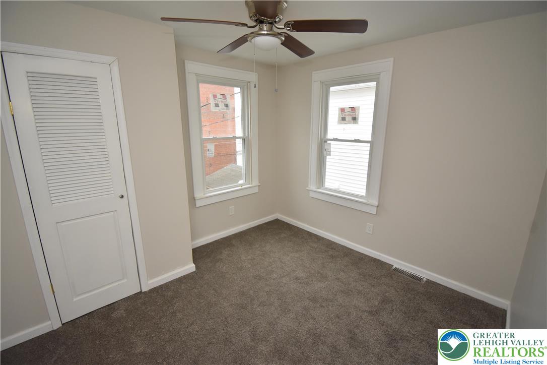 1105 Lehigh Street Easton, PA 18042 - Photo 5 of 9 an empty room with windows and fan