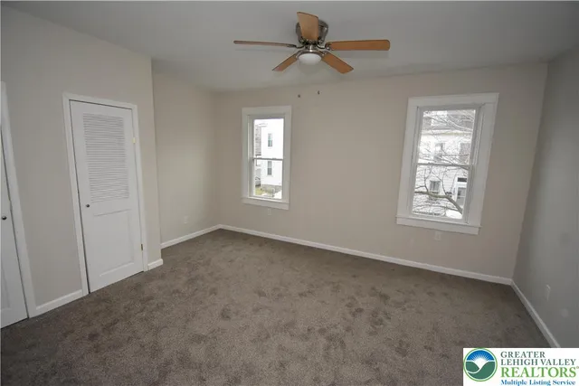 a view of an empty room with a window