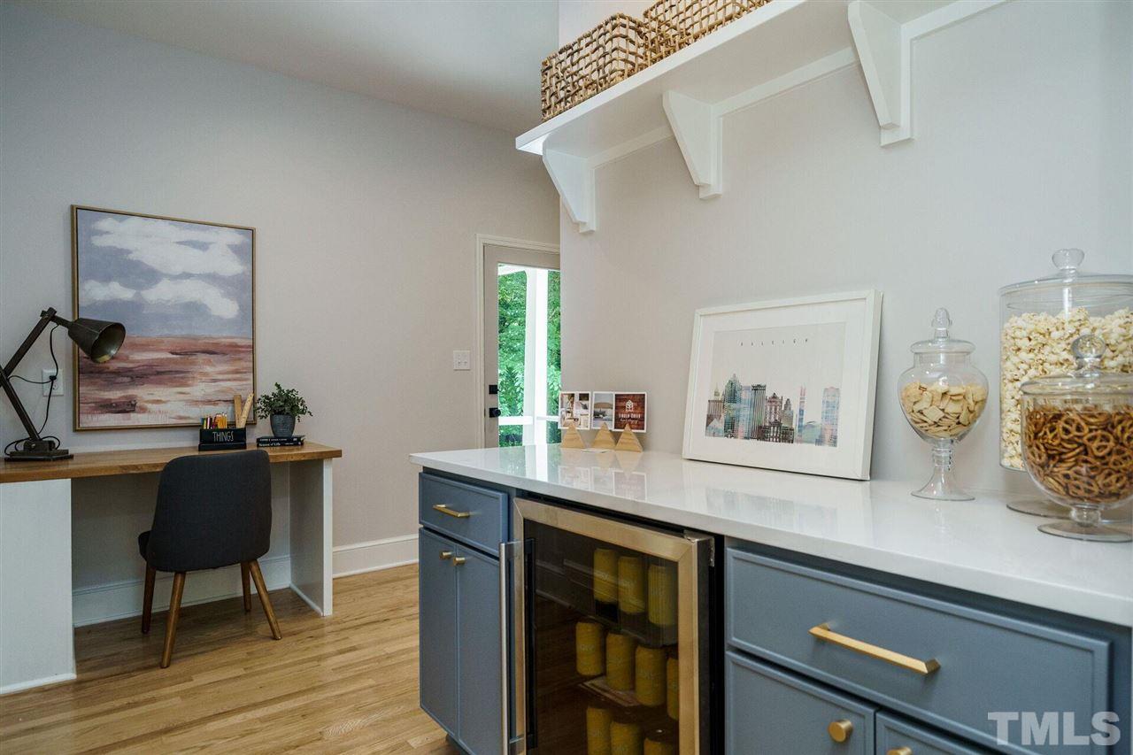 2005 Banbury Road Raleigh, NC 27608 - Photo 13 of 30 Another beverage station and plenty of storage for china and serving pieces. Desk offers nice place to work from home.
