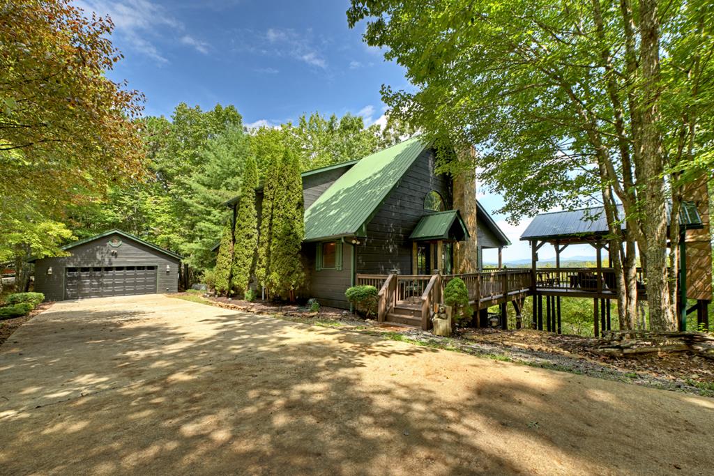 296 Overlook Road Blue Ridge, GA 30513 - Photo 1 of 65 a view of a house with a tree in the background