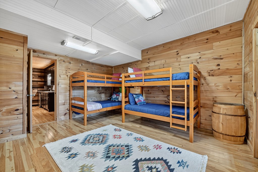 296 Overlook Road Blue Ridge, GA 30513 - Photo 60 of 65 a bedroom with furniture and a wooden floor