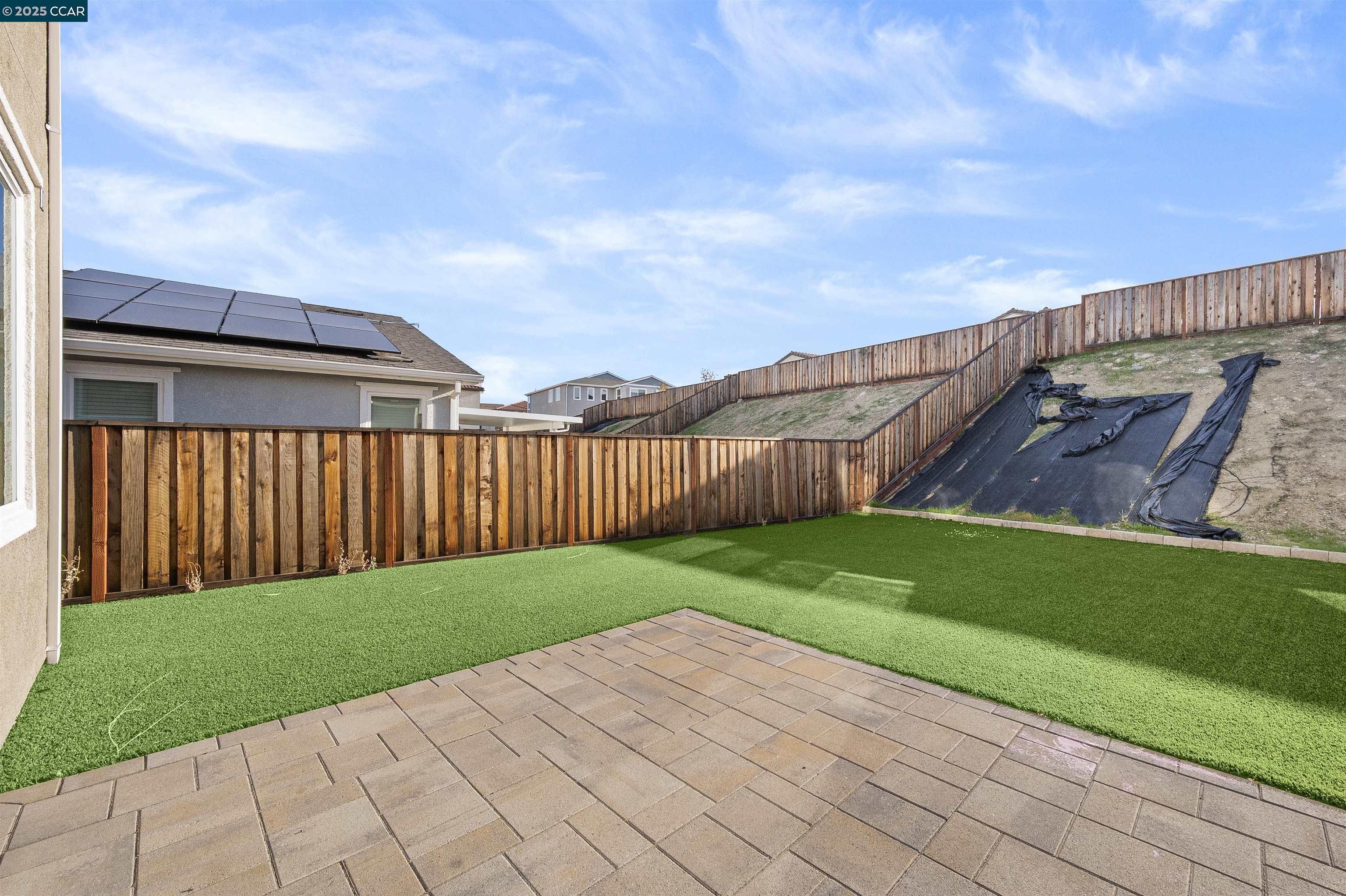 5541 Promontory Way Antioch, CA 94531 - Photo 3 of 59 a view of a backyard with wooden fence