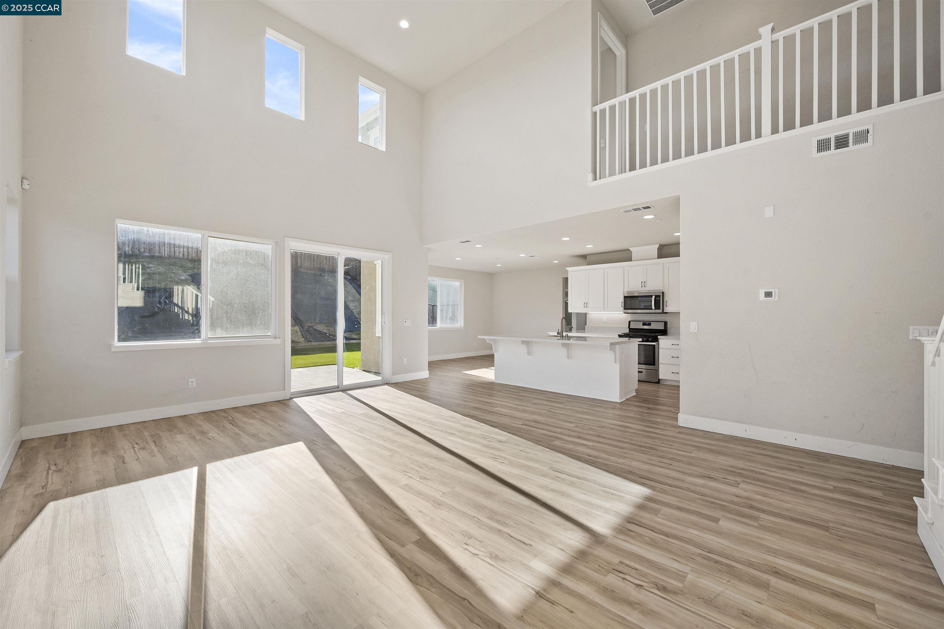 5541 Promontory Way Antioch, CA 94531 - Photo 33 of 59 a view of a living room with kitchen furniture and a window
