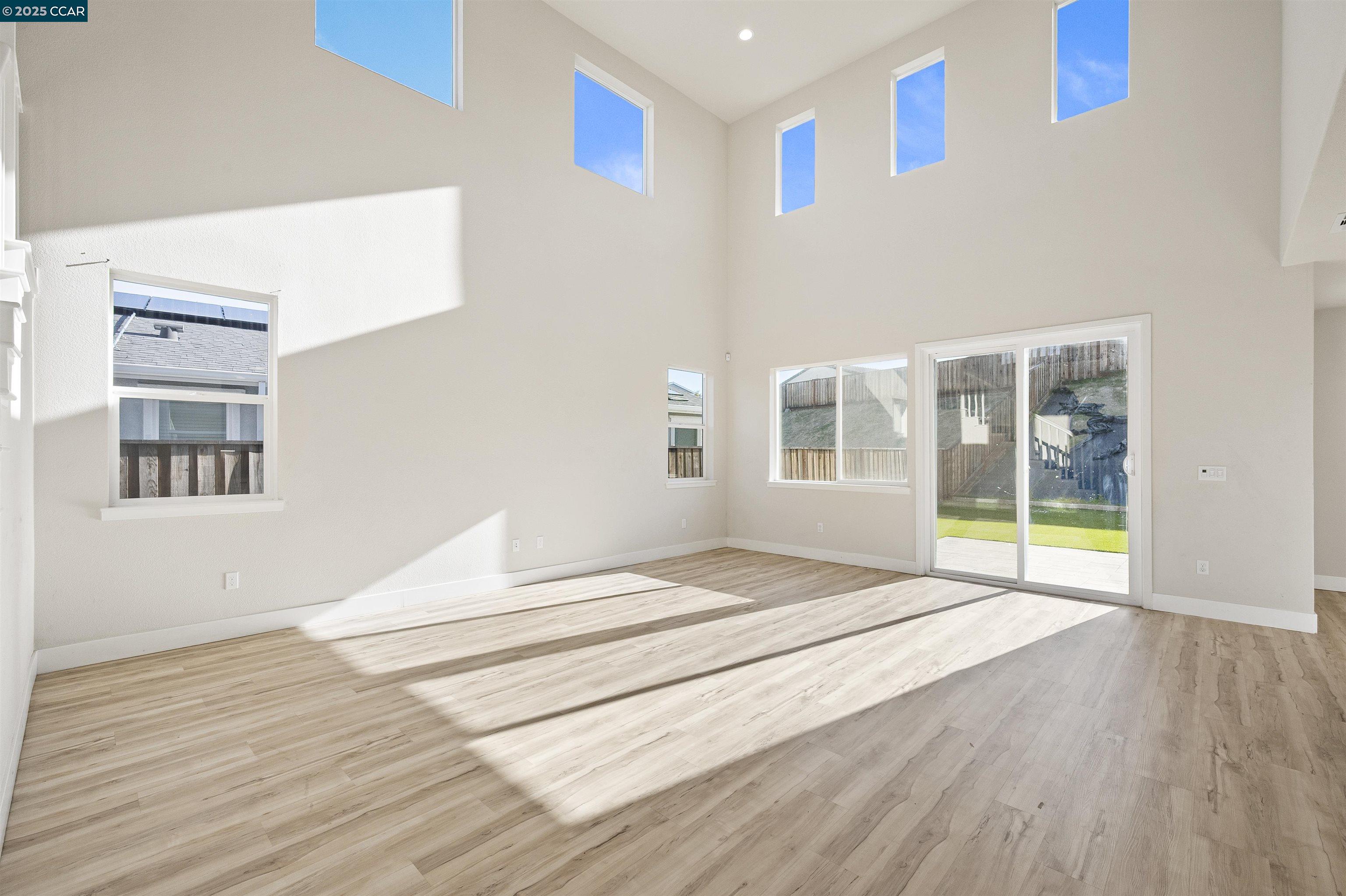 5541 Promontory Way Antioch, CA 94531 - Photo 34 of 59 a view of an empty room with wooden floor and a window