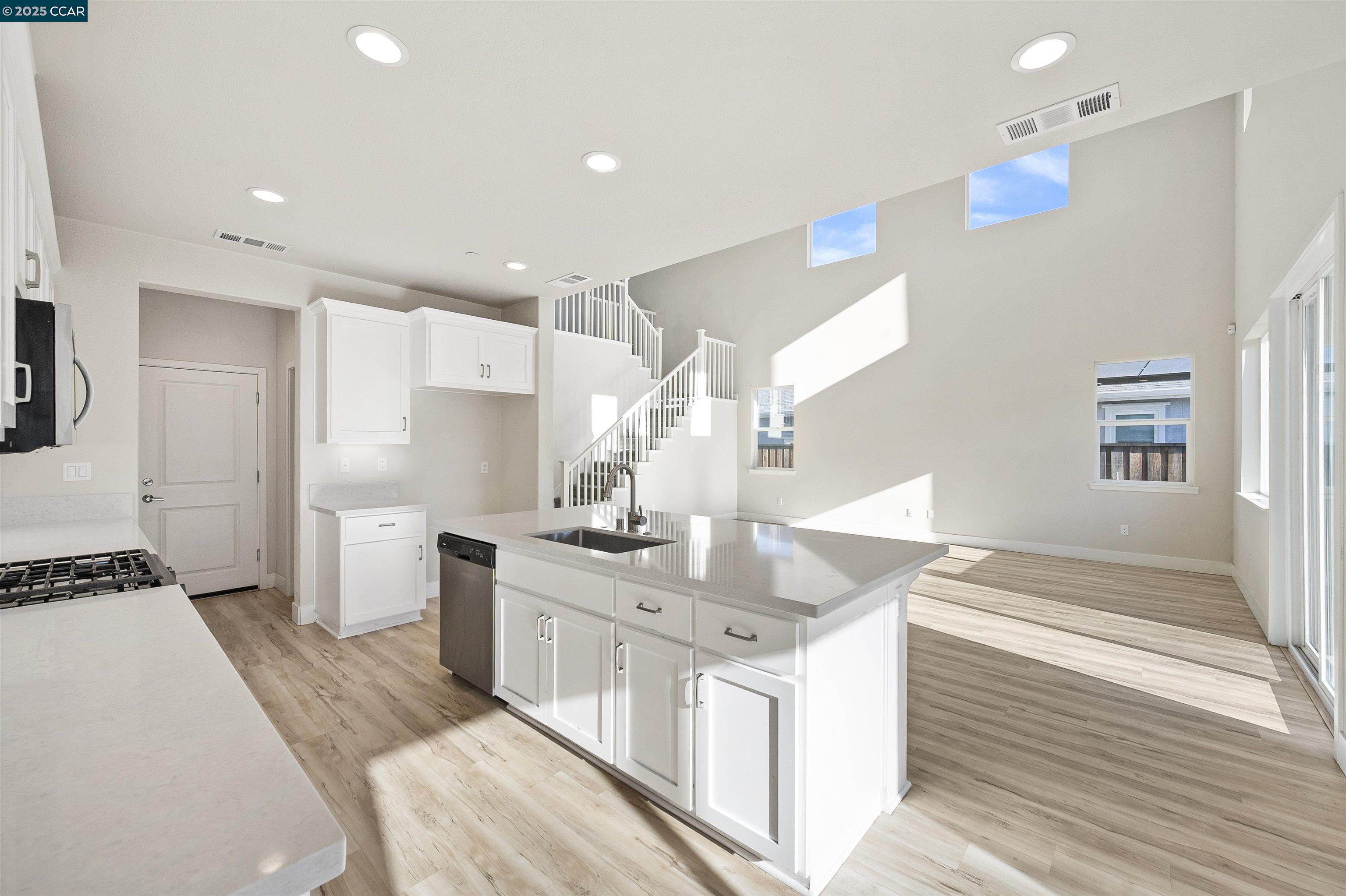5541 Promontory Way Antioch, CA 94531 - Photo 45 of 59 a kitchen with stainless steel appliances granite countertop a sink and a stove