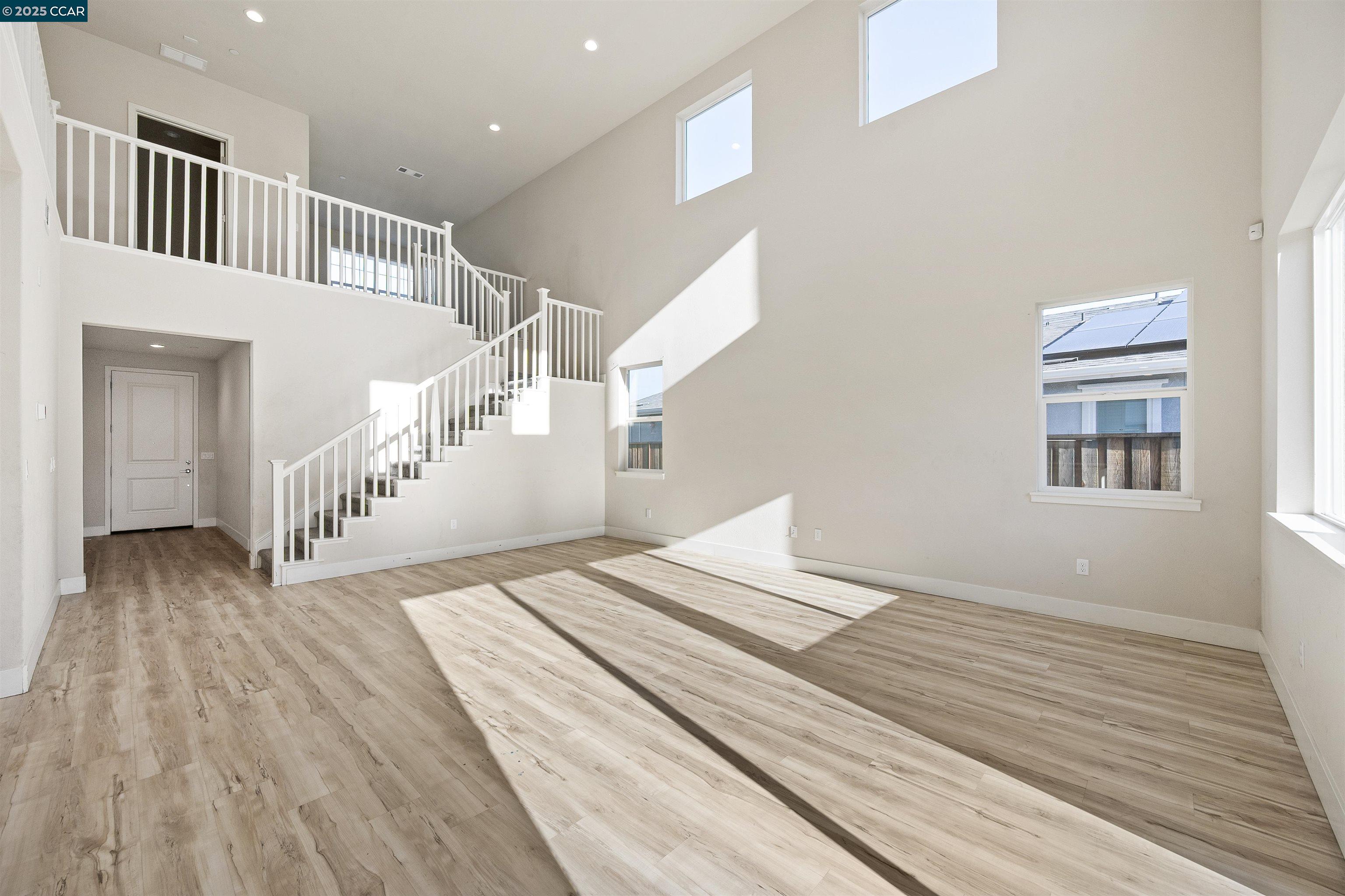 5541 Promontory Way Antioch, CA 94531 - Photo 52 of 59 a view of a bedroom with wooden floor and windows