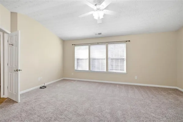 a view of an empty room with a window